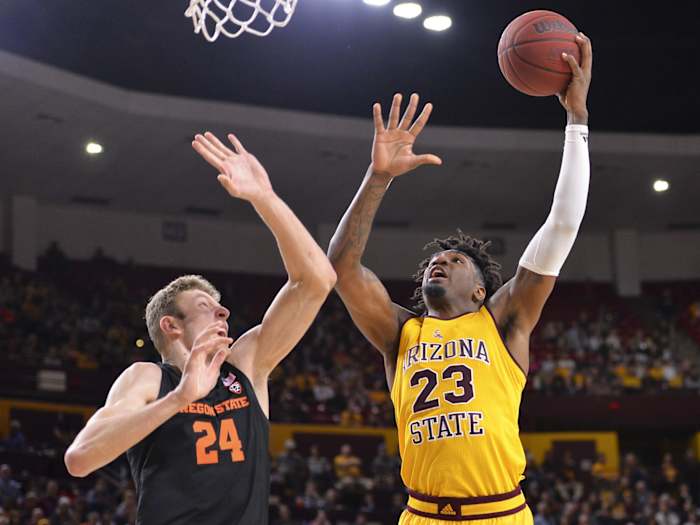 Arizona State Sun Devils forward Romello White (23) shoots the ball as Oregon State Beavers forward Kylor Kelley (24) defends during the second half at Desert Financial Arena. Mandatory Credit: Casey Sapio-USA TODAY Sports